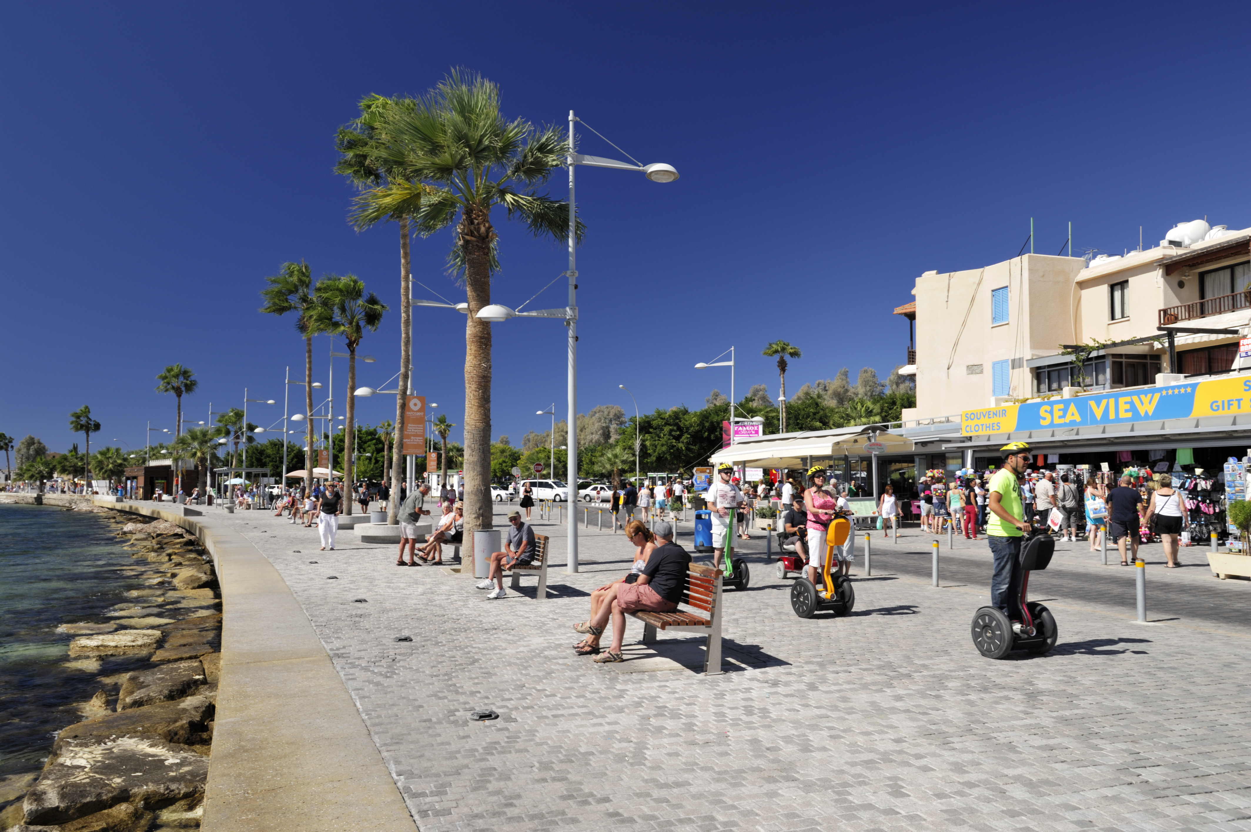 Tourism on promenade in Paphos - Cyprus.